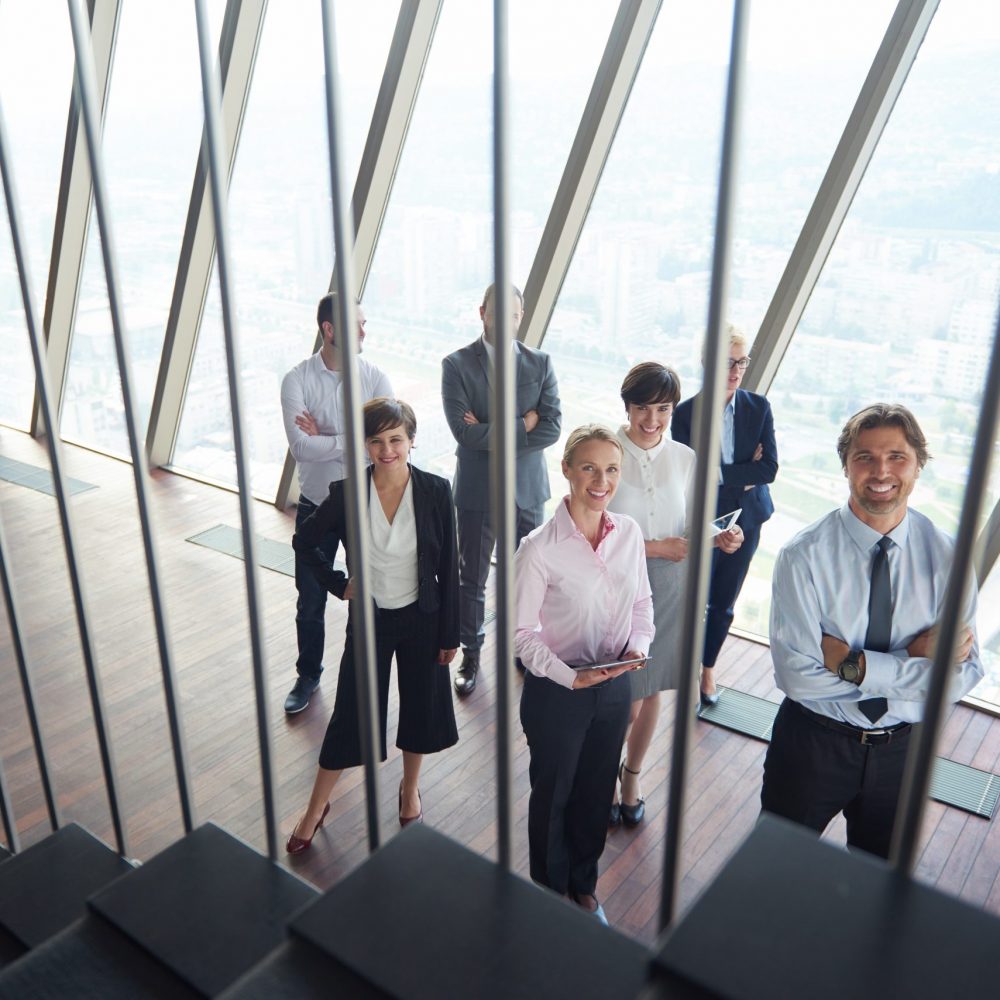 diverse business people group standing together as team  in modern bright office interior